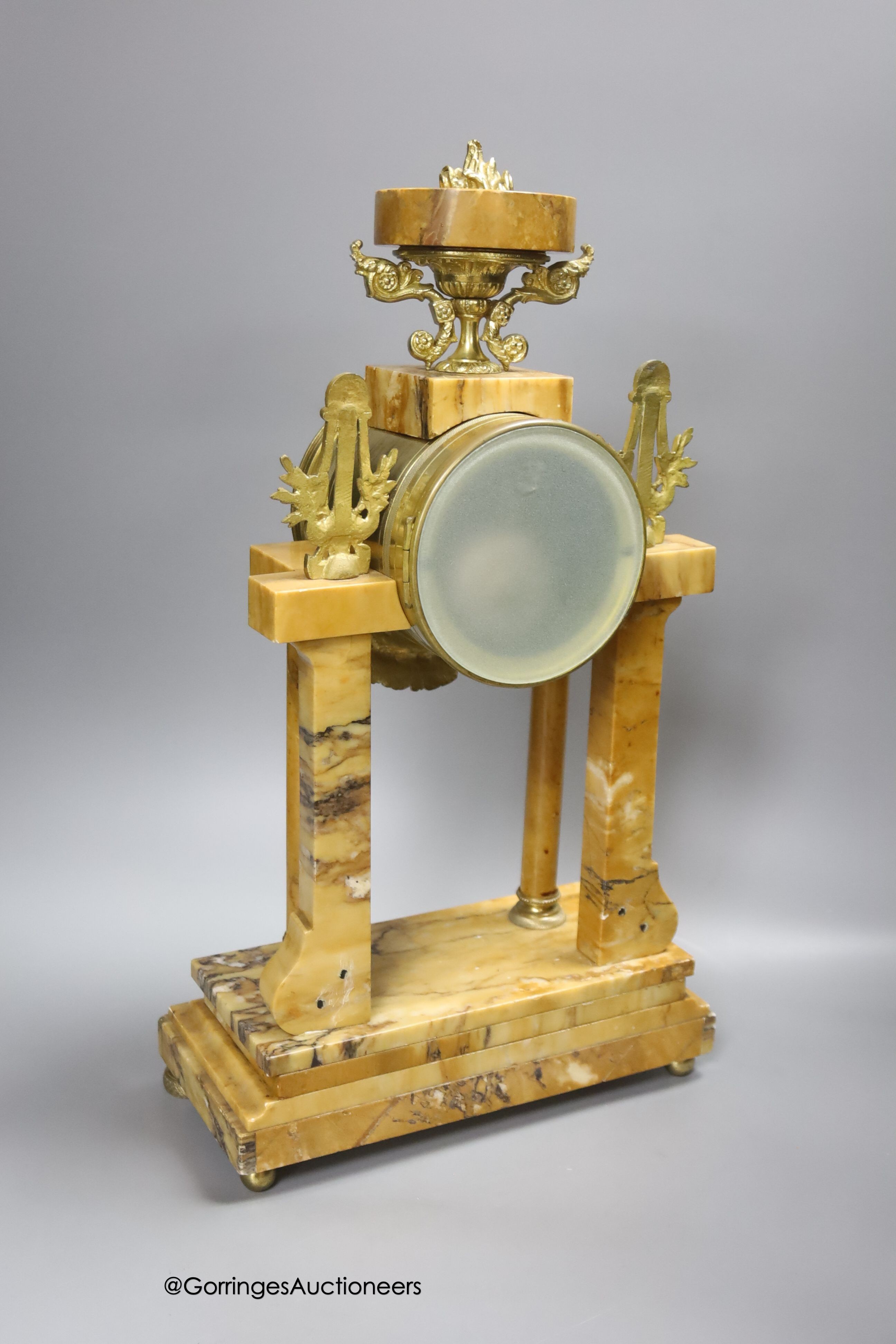 A 19th century French marble and gilt metal mantel clock, with key and pendulum, height 42.5cm